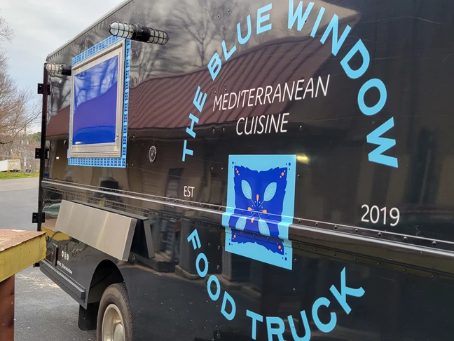 Side View of Blue Window Food Truck